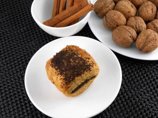 cake, walnut and cinnamon on white plate