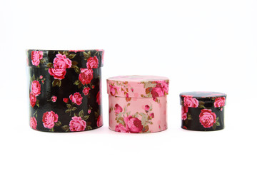 three colorful round boxes in row on white background