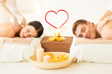 couple getting massage in spa salon