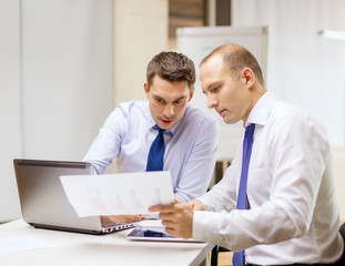two businessmen having discussion in office