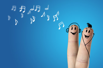 happy finger couple listening to music