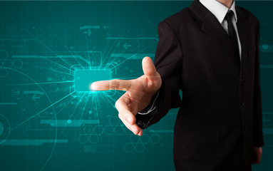 Businessman pressing high tech type of modern buttons
