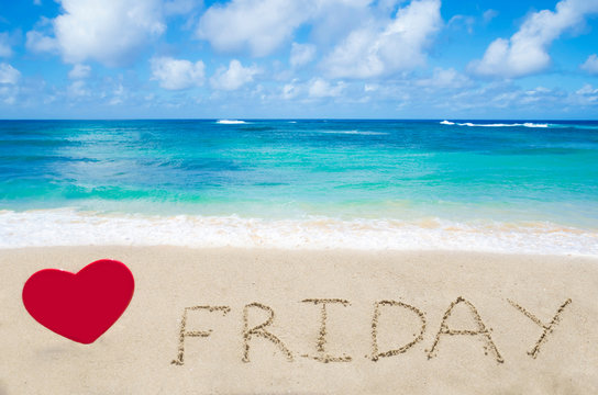 Sign "Friday" on the sandy beach