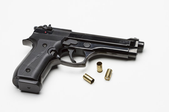 Handgun with bullets, horizontal