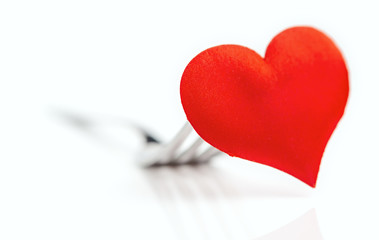 red heart on a fork