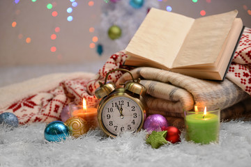 Composition with plaids, candles and Christmas decorations,