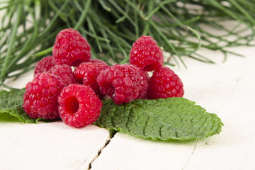 natural raspberries on white background