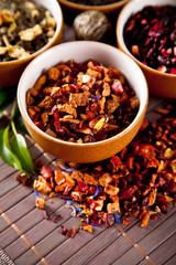 Various dry tea in small bowls