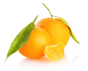Ripe sweet tangerine with leaves, isolated on white
