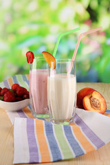 Delicious milk shakes with strawberries and peach