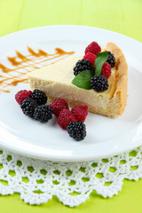 Slice of cheesecake with raspberry and blackberry