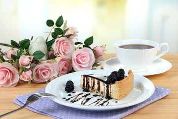 Slice of cheesecake with chocolate sauce and blackberry