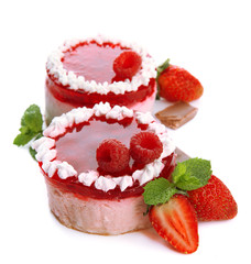 Delicious berry cakes isolated on white