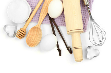 Obraz na płótnie Canvas Cooking concept. Basic baking ingredients and kitchen tools