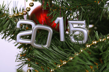 2015 hang on Christmas tree close-up isolated on white
