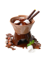Chocolate fondue with marshmallow candies, isolated on white