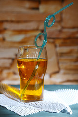 Glass of cocktail, on stone wall background