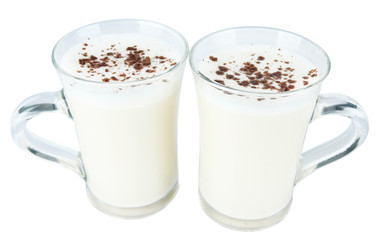 Cups of eggnog isolated on white