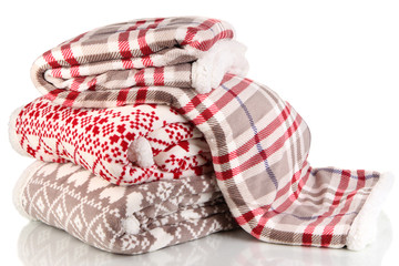 Pile warm plaids isolated on white