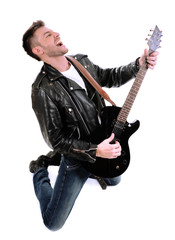 Fototapeta premium Young musician playing guitar, isolated on white