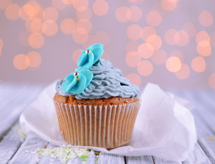 Tasty cupcake with butter cream,