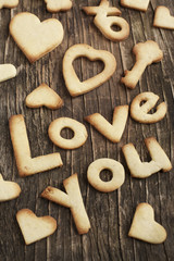 Text Love you from Sugar Cookies on a wooden background