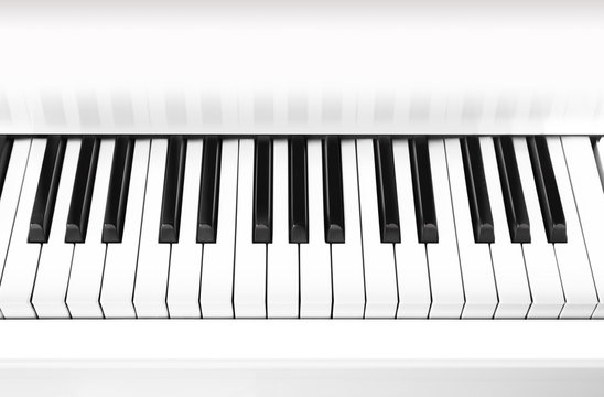 White grand piano key closeup, background.