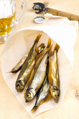 Mug of beer with smoked fish