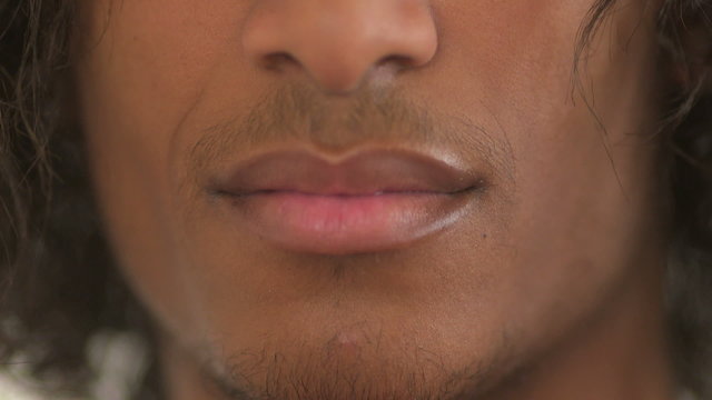 Close-up of black teenager sticking his tongue out