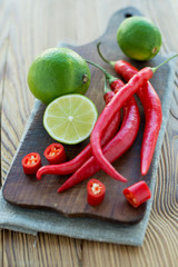 Still life of the essential thai flavours of lime and chili