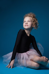 Fototapeta premium Image of little modern ballerina smiling in studio