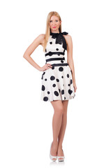 Tall model dressed in dress with polka dosts on white