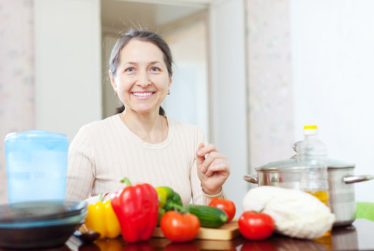 Smiling Mature Woman With Vegetables