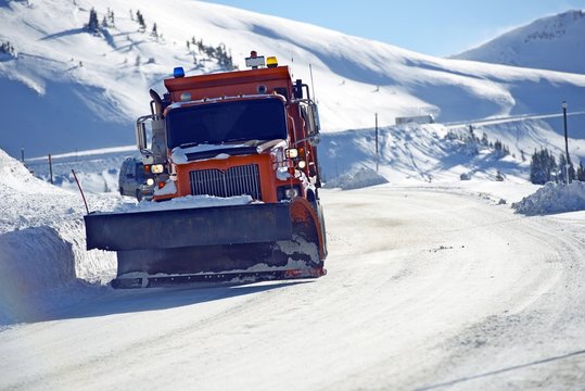 Snowplow Clearing Road