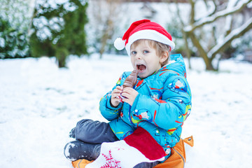 Portrait of little toddler boy three years old in winter
