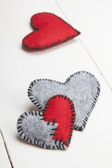 felt heart on a white wooden background, valentines composition