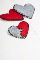 felt heart on a white wooden background, valentines composition