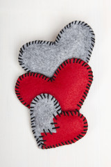 felt heart on a white wooden background, valentines composition
