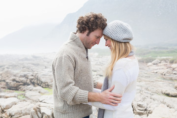 Fototapeta premium Romantic couple standing on a rocky landscape