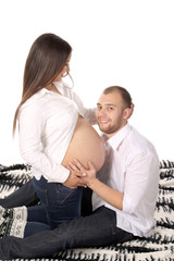 Fototapeta premium Happy men smiling with pregnant woman.