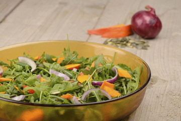 green salad with onion and pumpkin