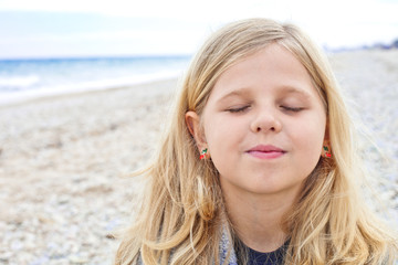 cute young girl at the beach