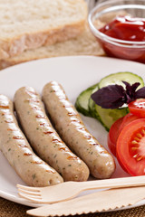 Grilled pork sausages on a plate