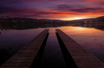 Obraz premium Mystical Landscape, two long pier at dawn