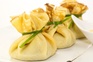 pancakes with meat on a table in a restaurant