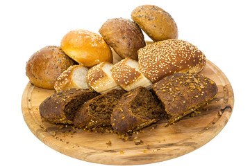 bread and buns on wooden plate