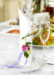 decorated table ware glass glasses and fresh flowers