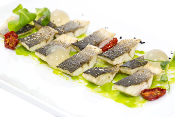 baked black cod fish on a white background in the restaurant