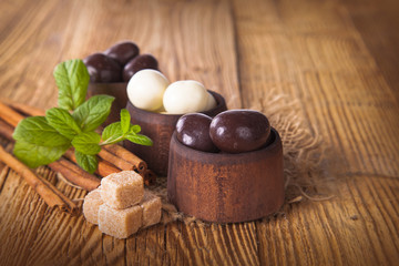 Fototapeta na wymiar chocolate nut on wooden table 