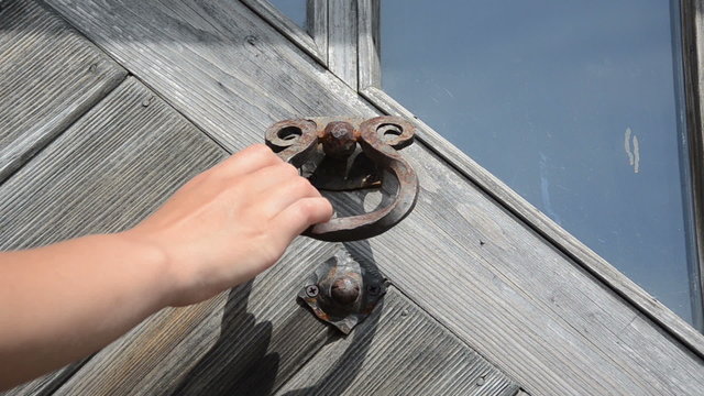 guest hand knock retro rusty door handle used as ringer knocker